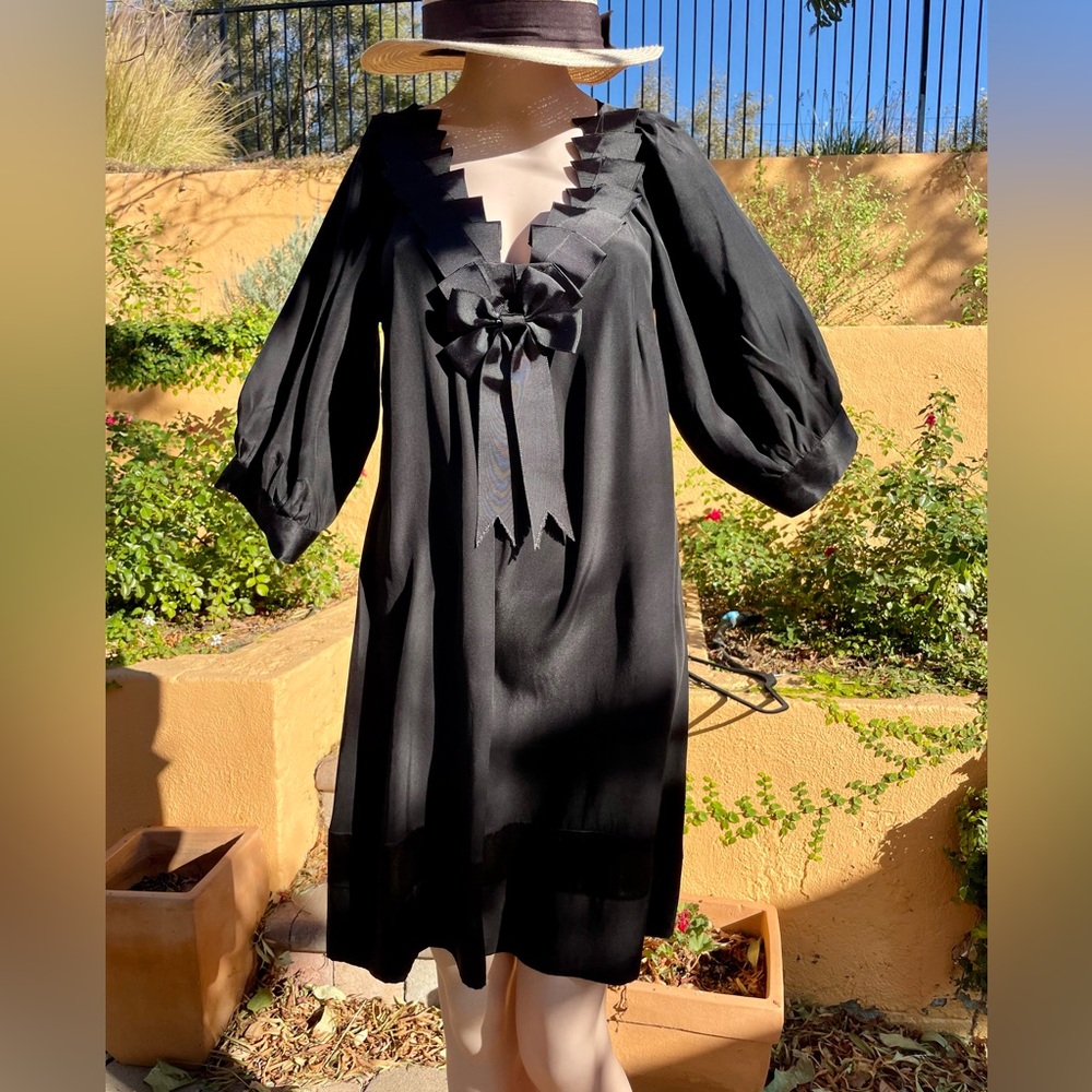 Cute flowing black party dress with neck ribbon and bow one size but about a 6-8